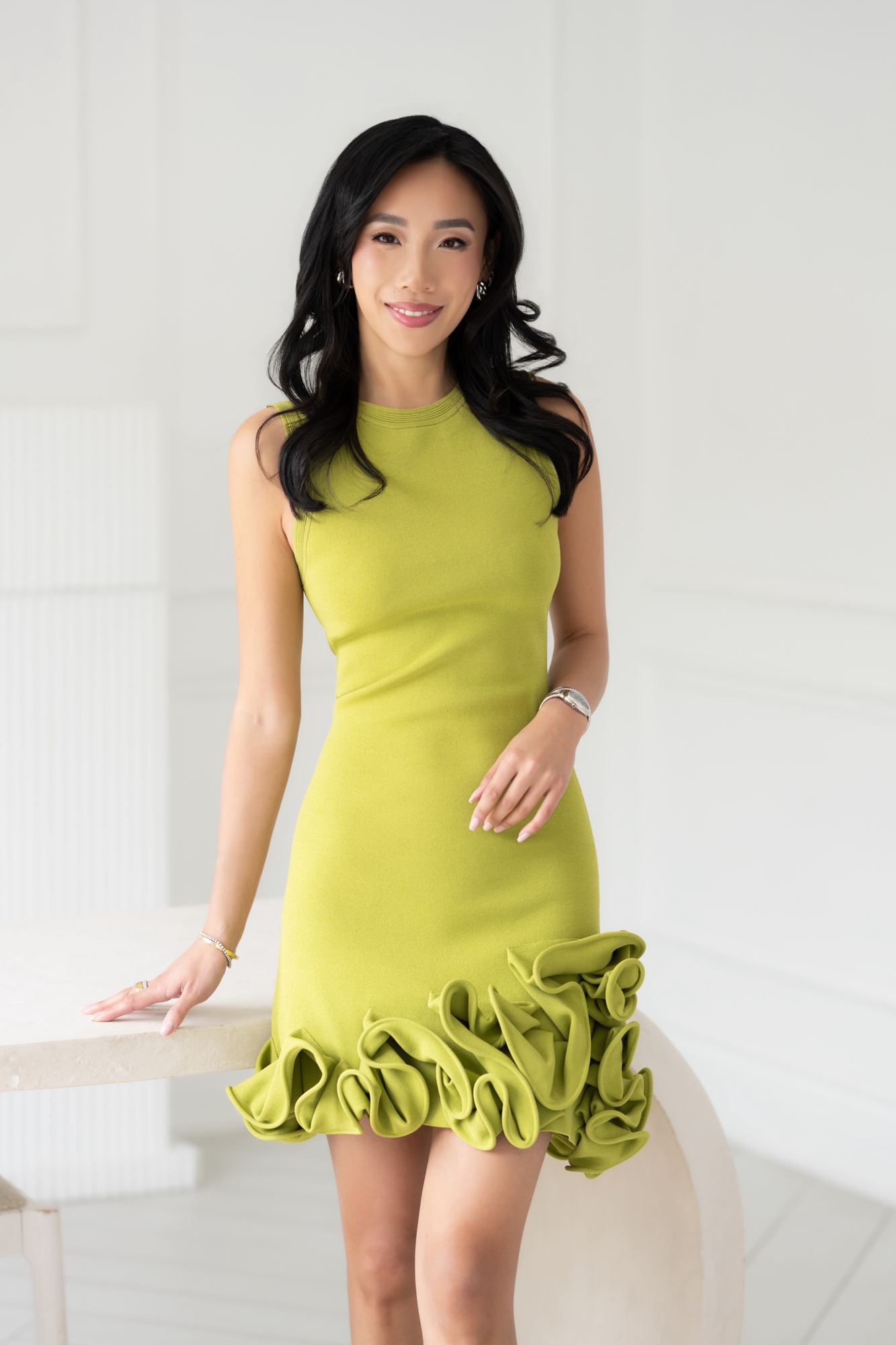 Eva Luk in a lime green dress