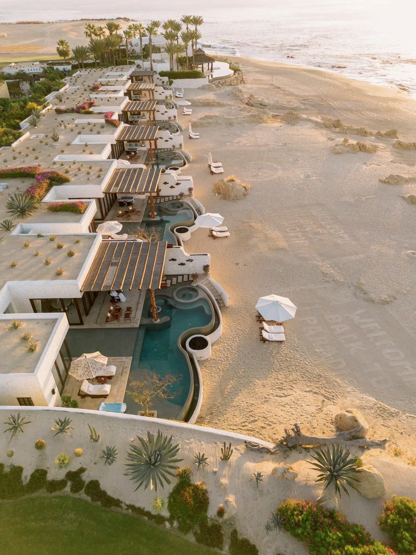 Beachfront villas with private pools in Los Cabos at sunrise