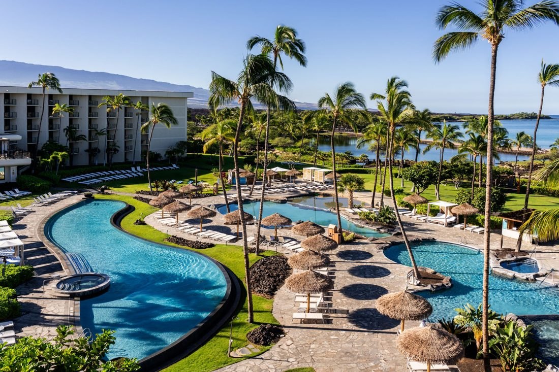A resort with winding pools beside the ocean
